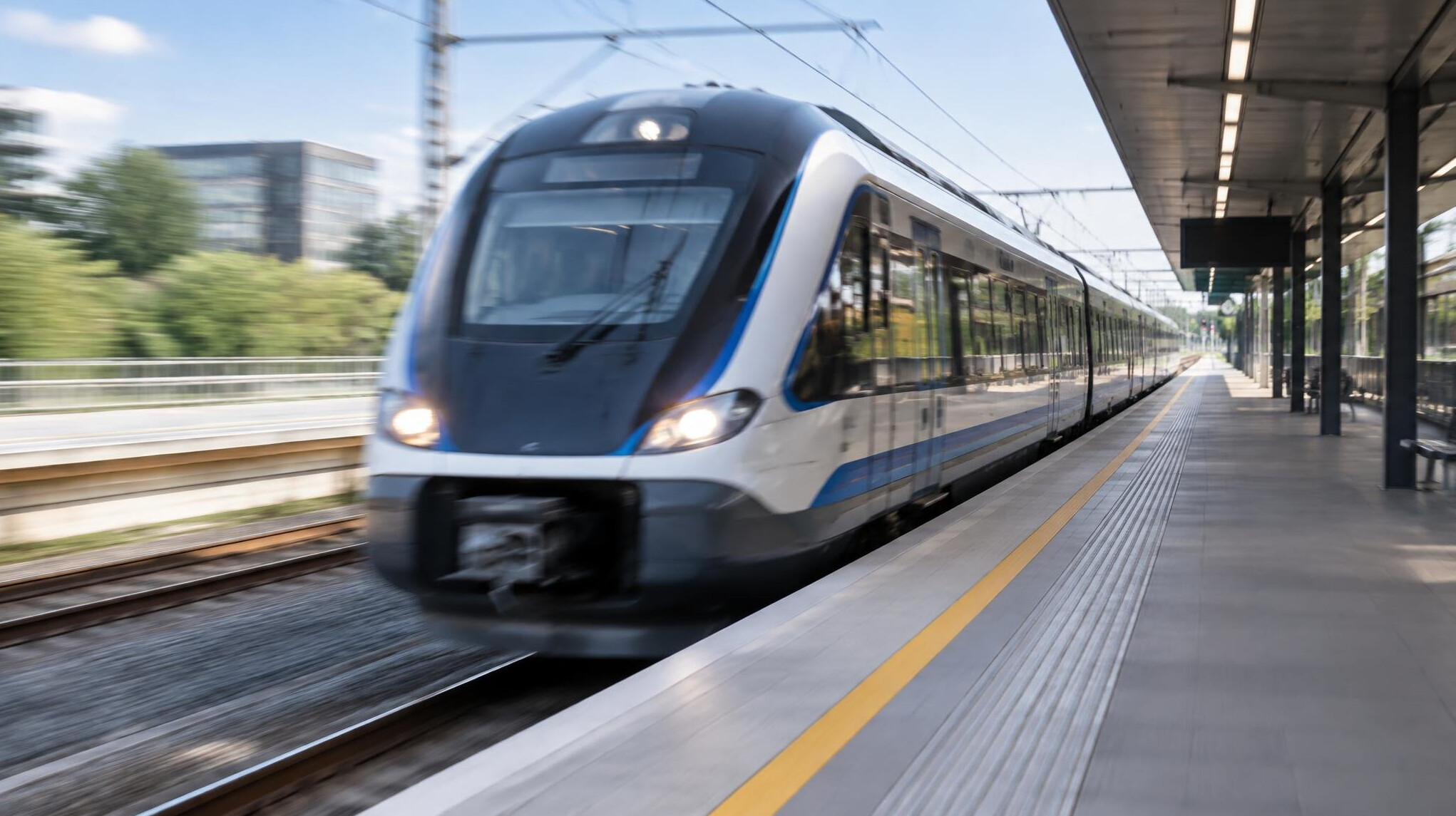 Passenger train arriving at a railway station